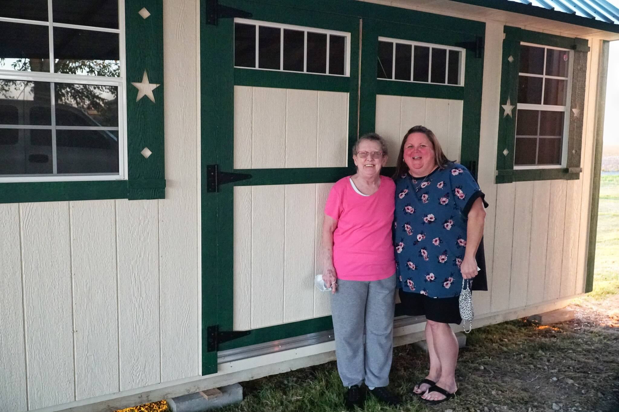 Trudy Rankin and Tracey Langley with their new shed
