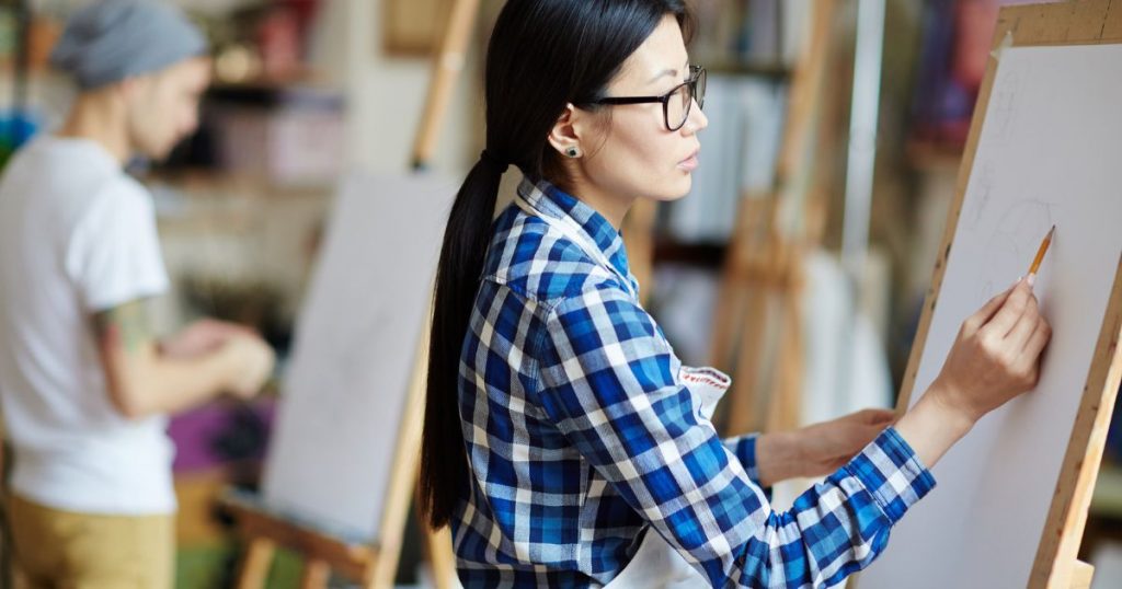 - woman sketching on canvas
