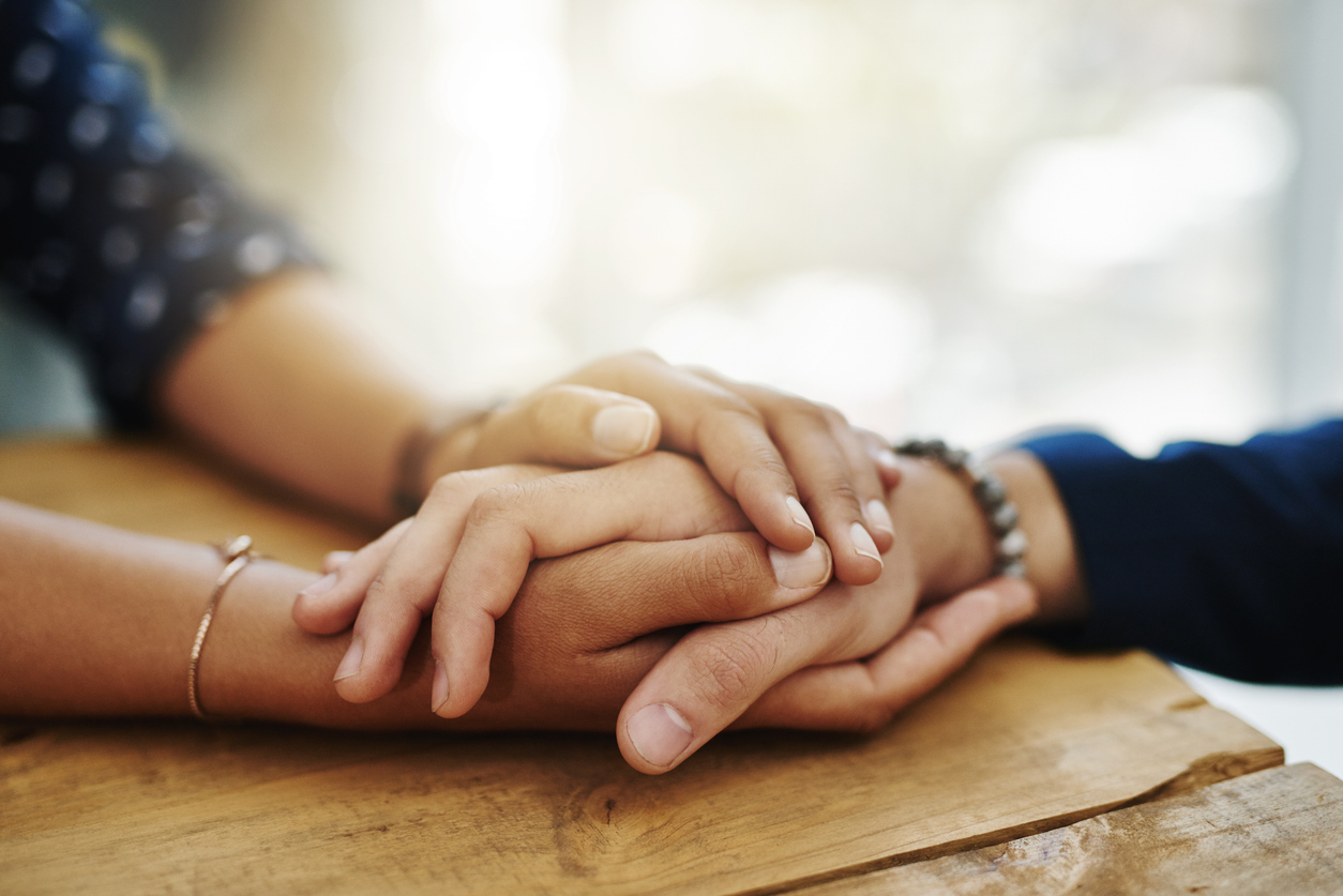 Hands offering support and hope