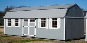  -  - Gray lofted barn side-entry by Leland's: ample storage, loft space, and sturdy construction for all your storage needs.