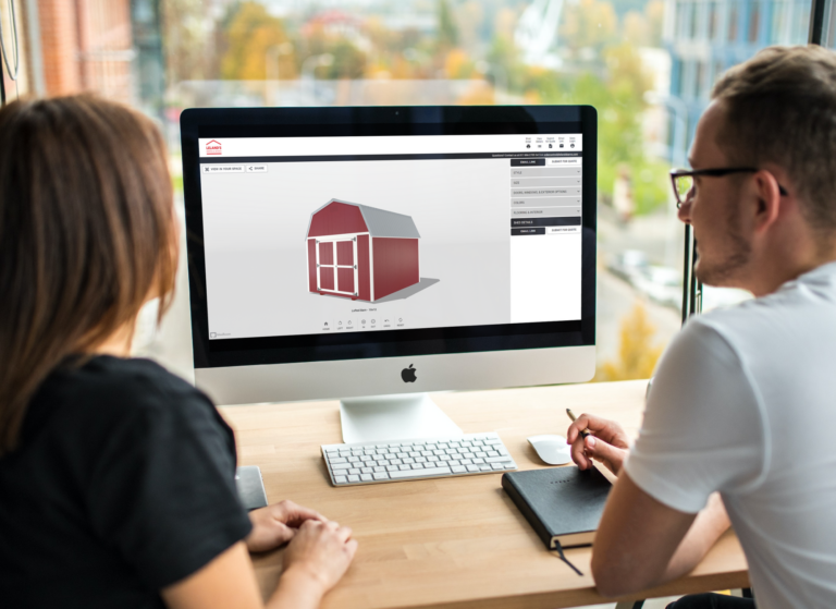 man and woman shopping for gym sheds for sale online.