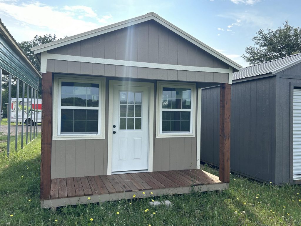  -  - For sale: Two 12x24 Diamond Cabinette Sheds sitting in a grassy area.