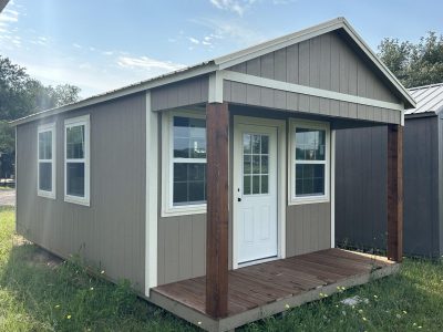 Find a 12x24 Diamond Cabinette Shed in a grassy area at sheds on sale.