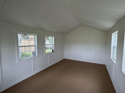 A 12x24 Diamond Cabinette Shed with white walls and windows available for sale as a shed.