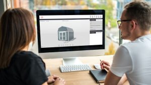 man and woman designing a shed online