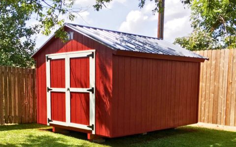 red utility shed with white trim makes for an attractive color combination
