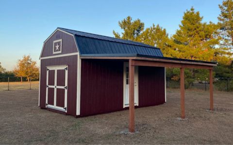 dark red lofted barn shed with carport