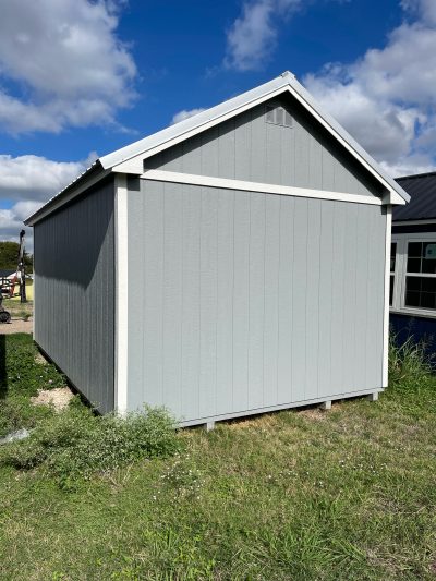 A 12x20 Chalet Shed on sale, sitting in a grassy area near me.