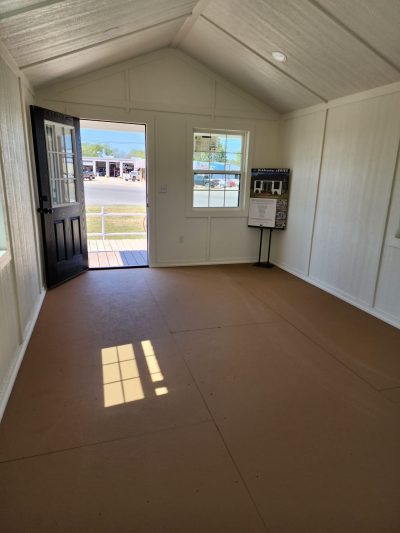 A 12x24 Diamond Cabinette Shed with a white floor and a door.