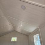 A room with a white ceiling and a window, perfect for those looking for the 12x24 Diamond Cabinette Shed on sale near me. - LELAND'S SHEDS - A room with a white ceiling and a window, perfect for those looking for the 12x24 Diamond Cabinette Shed on sale near me.