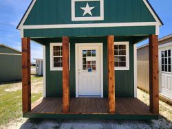 A 12x24 Lofted Barn with a star on it is available for sale at a nearby shed store.