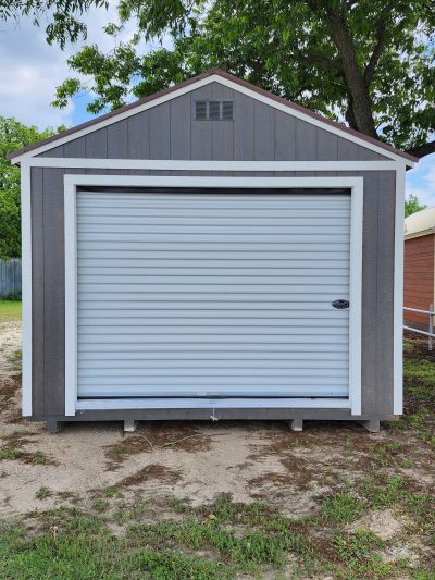 A 12x24 Garage Shed with a white door and a gray roof for sale.