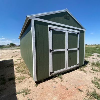 For sale: A 12x24 Utility Shed in a dirt field.