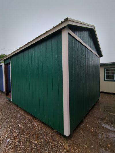 A 12x16 Cabinette Shed on sale in a parking lot.