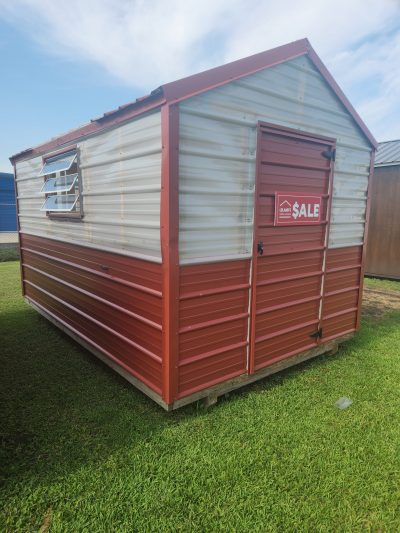 An 8x12 Greenhouse with a sale sign on it, available for purchase.