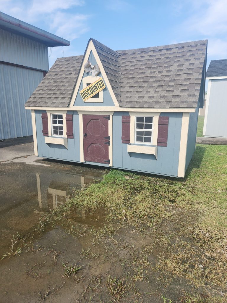  -  - For sale: A blue and white 8x12 Victorian Playhouse with a blue roof.