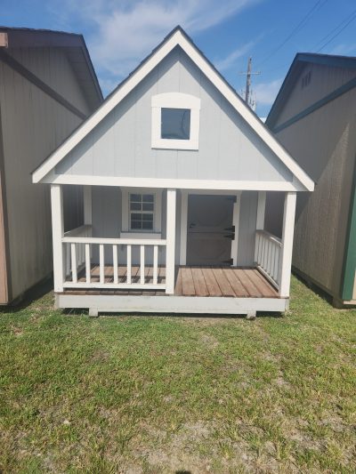 An 8x10 Hideout Playhouse with a porch and a deck available for sale.