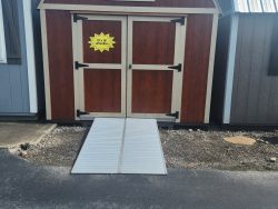 A 10x16 Lofted Barn with a door and a star on it, perfect for sale.
