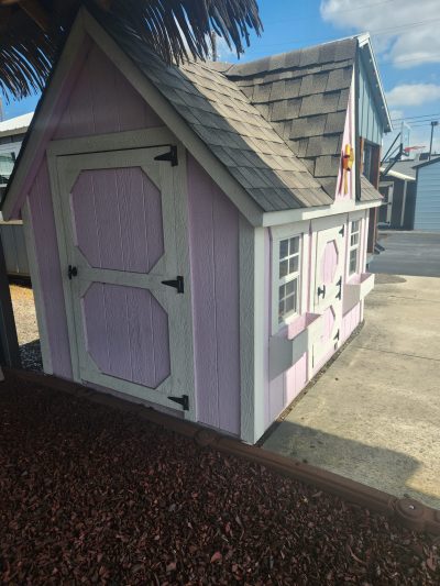 An 8x8 Victorian Playhouse with a roof available for sale.