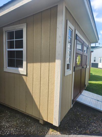 An 8x12 Studio Shed with a door and window, available for sale near me.