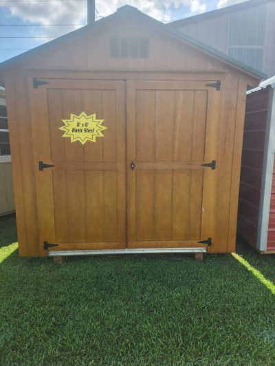 For sale: an 8x8 Basic Shed with a yellow sign on it.
