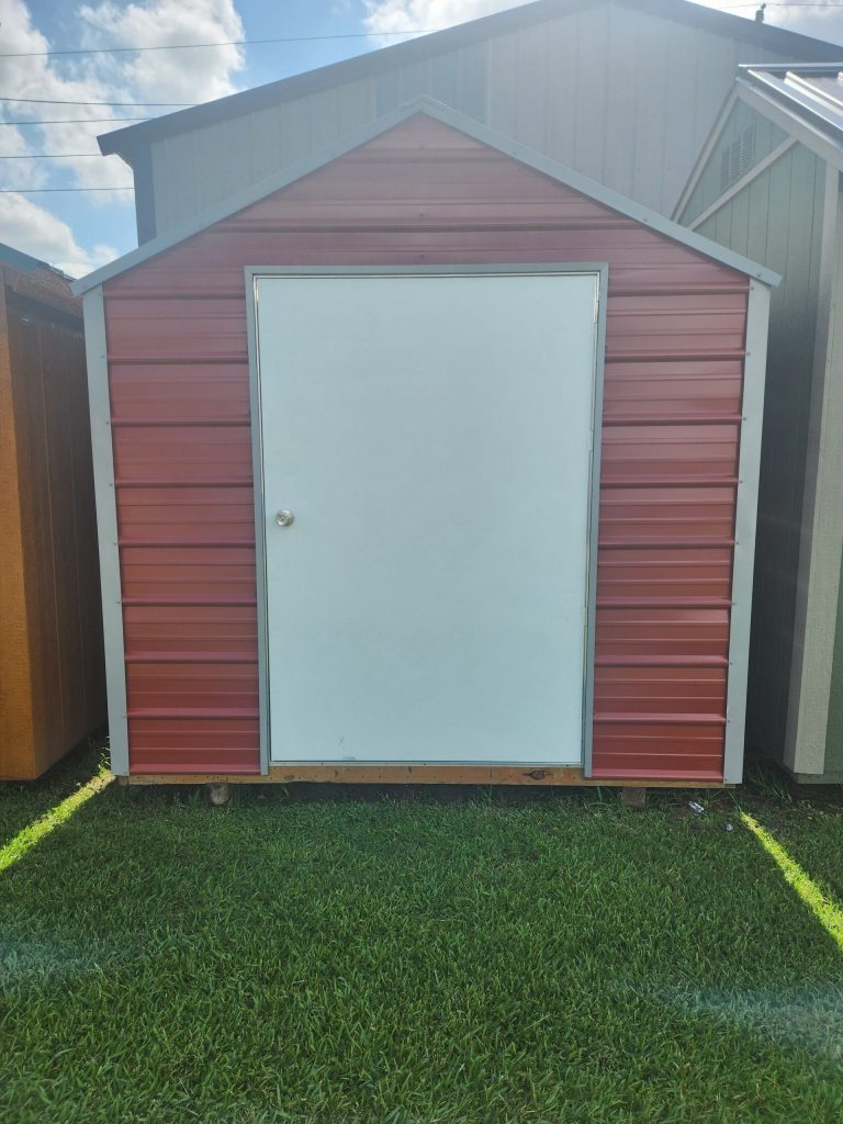  -  - For sale: An 8x10 metal shed with a white door.