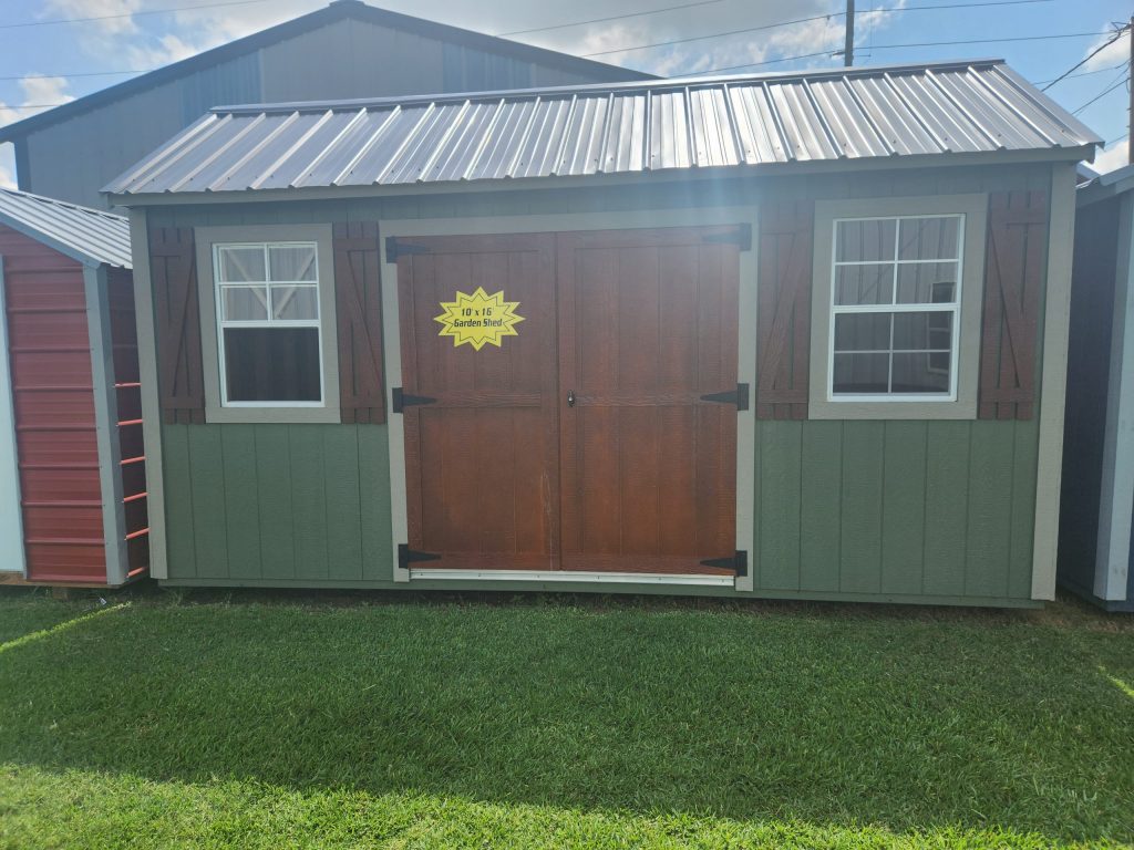  -  - For sale 10x16 Garden Shed: A green and brown shed with a yellow door.