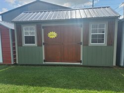 For sale 10x16 Garden Shed: A green and brown shed with a yellow door.