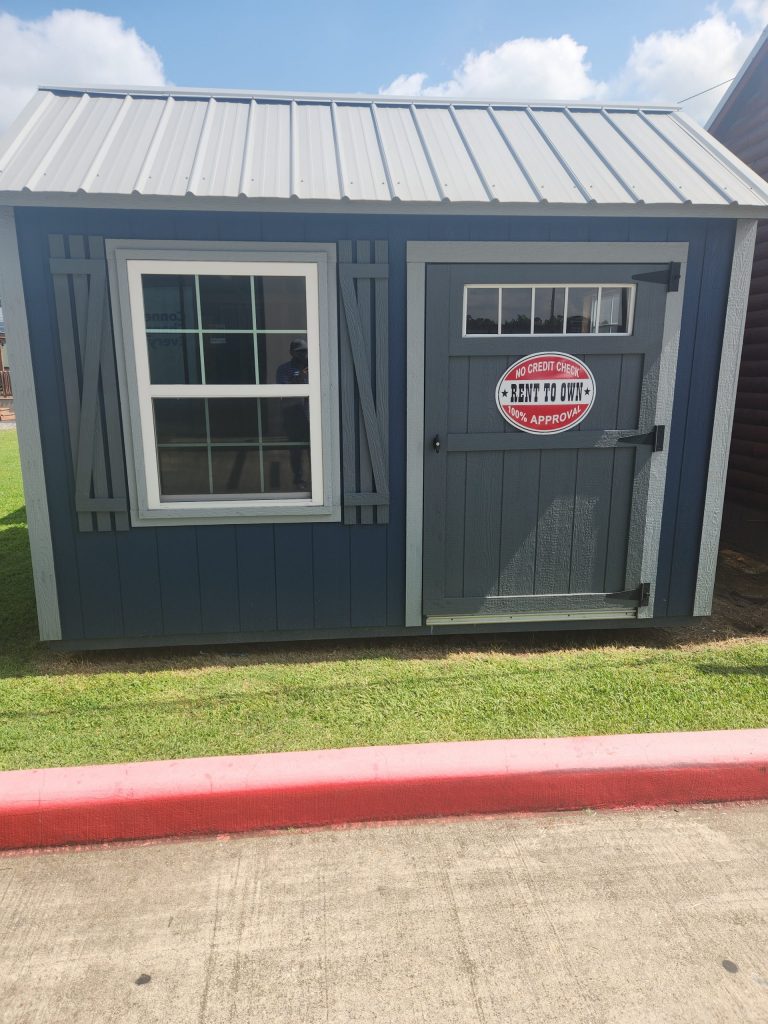  -  - A 10x12 Garden Shed with a red door, available for sale.