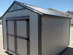 For sale: A 10x12 Utility Shed in a parking lot.