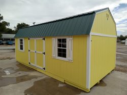For sale: A 12x24 Lofted Barn Shed with a green roof.