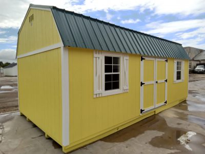 A 12x24 Lofted Barn Shed with a green roof on sale near me.