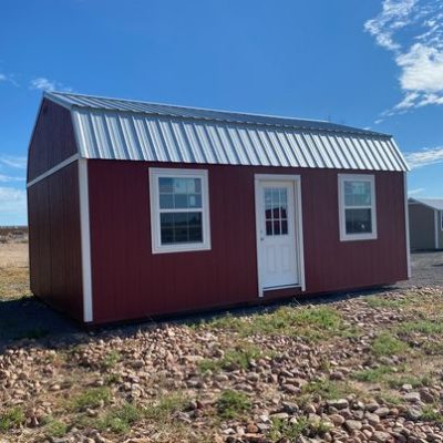For sale 16x24 Lofted Barn Shed: A red shed with a metal roof in a field.