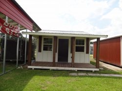A 16x30 Cottage Shed with a porch, available for sale.