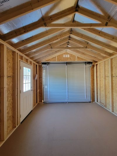 A 12x20 Garage Shed with a sliding door, available for sale.