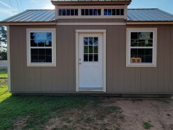 A 12x20 Chalet Shed with a window and a door available for sale.