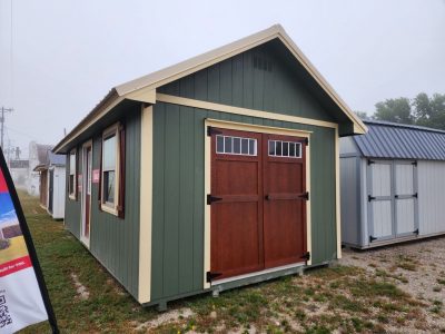 A 12x24 Chalet Shed with a wooden door for sale at a shed store near me.