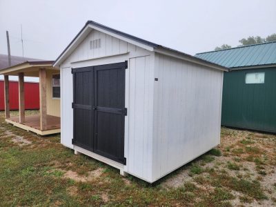For sale 10x10 Utility Shed: A white and black 10x10 Utility Shed with a black door.