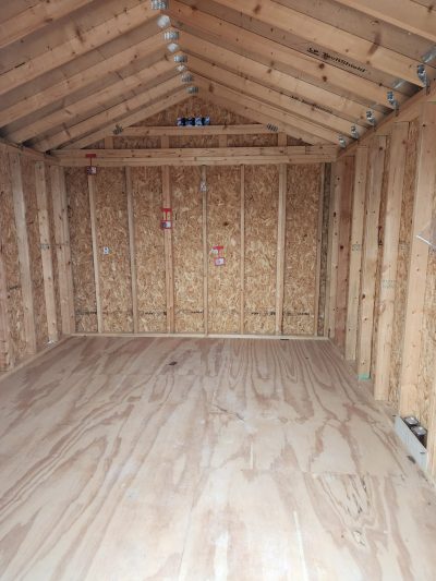 A spacious 10x12 Utility Shed with durable wood flooring, available for sale.