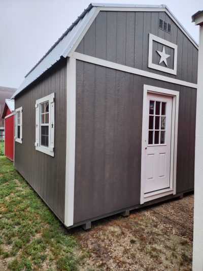 A 14x16 Lofted Barn shed for sale with a star on it.