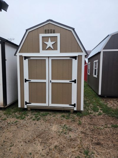An 8x12 Lofted Barn for sale with a star on it.