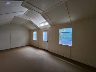 An airy room with large windows and a spacious 12x24 Diamond Chalet Shed.