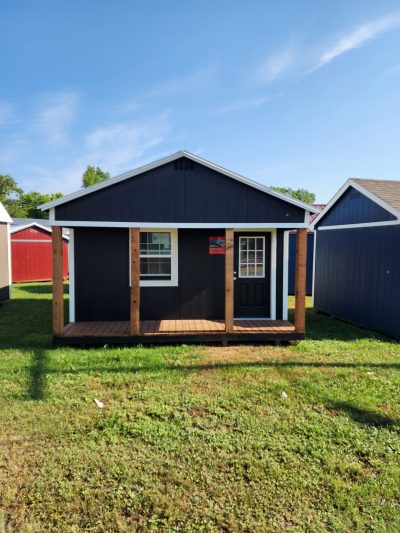 A 16x20 Cabinette Shed with a blue roof for sale on sale.