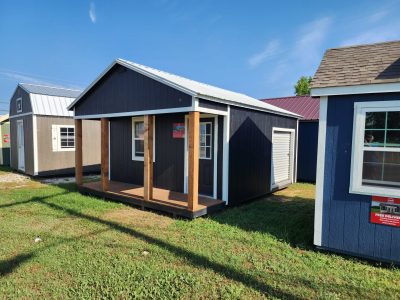 A yard with a 16x20 Cabinette Shed for sale.