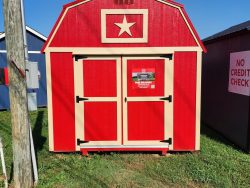 A 10x16 Lofted Barn with a star on it for sale.