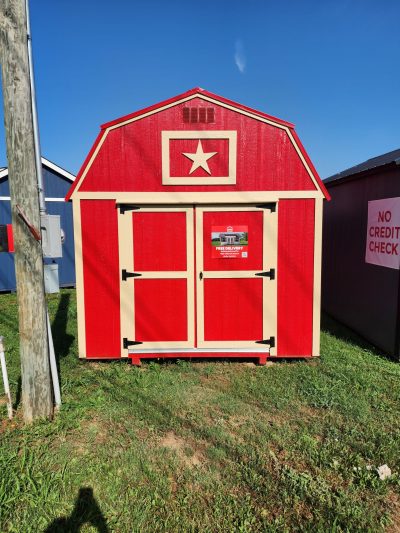 For sale: A red 10x16 Lofted Barn with a star on it.
