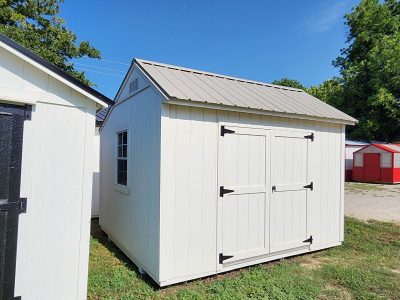 Two 10x12 Garden Sheds for sale sitting next to each other.