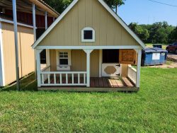 A 10x12 Hideout Playhouse on sale with a porch.