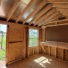 Explore a spacious 10x12 Utility Shed adorned with rustic wood beams and an elegant window for a glimpse of the outdoors. Whether you're searching for sheds for sale near me or seeking out the nearest shed store