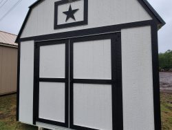 A 10x16 Lofted Barn Shed with a star on it for sale.